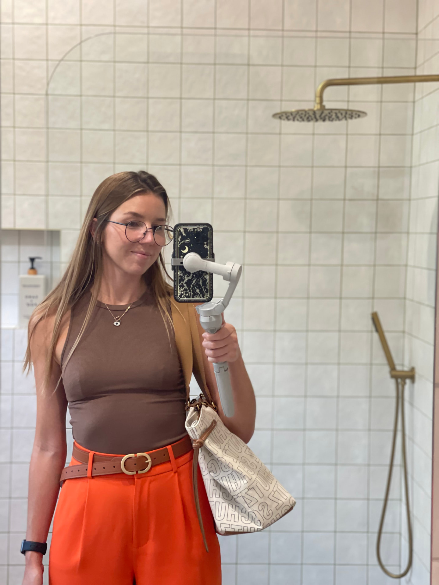 Giulia filming content with a phone gimbal